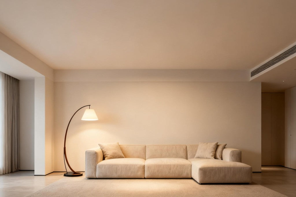 Living room with an arched floor lamp beside a cream sofa