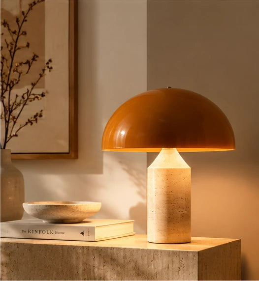 Mushroom table lamp with amber dome shade on a stone side table